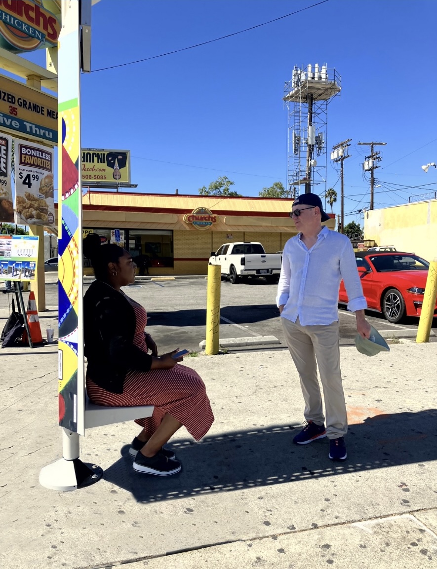Two Patrons Chatting Underneath the ShadeBlade near Church’s Chicken